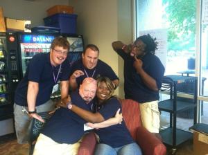 John Lee (bottom left) being silly with fellow staff at GTI.